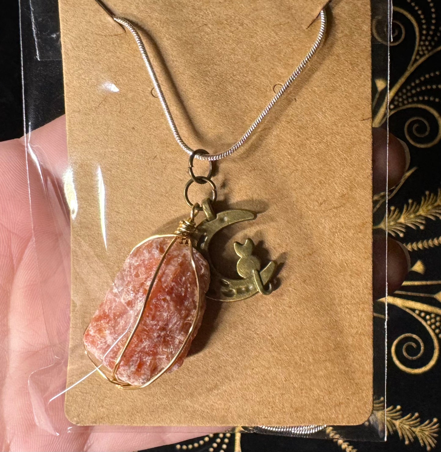 Red calcite and cat charm necklace