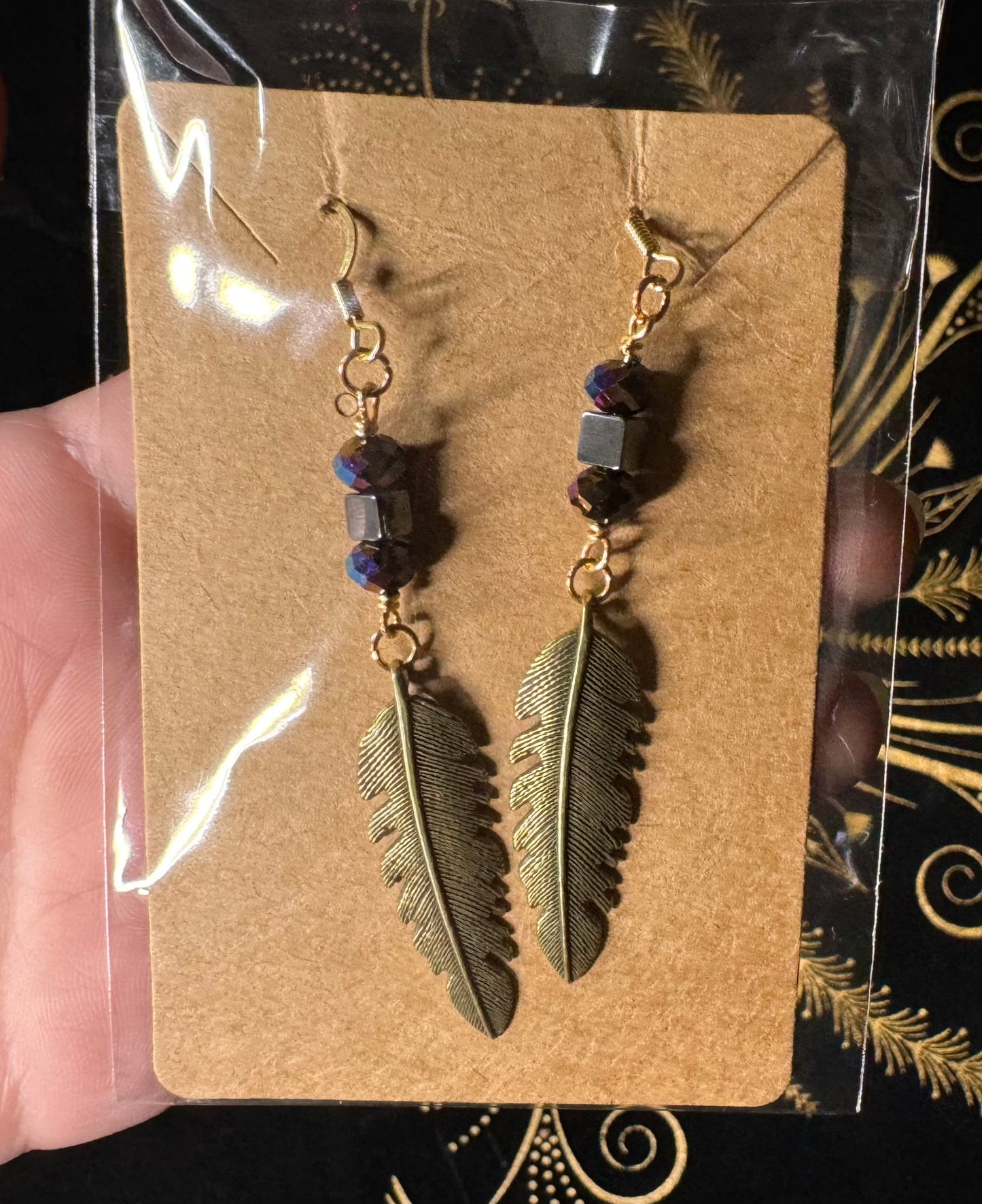 Bronze feather charm earrings