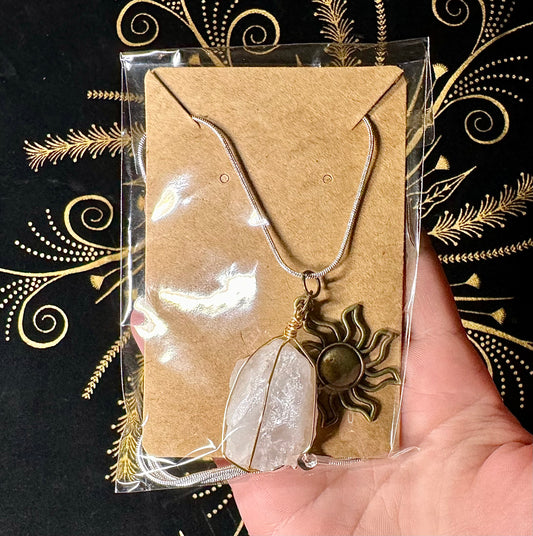 Clear quartz and sun charm necklace